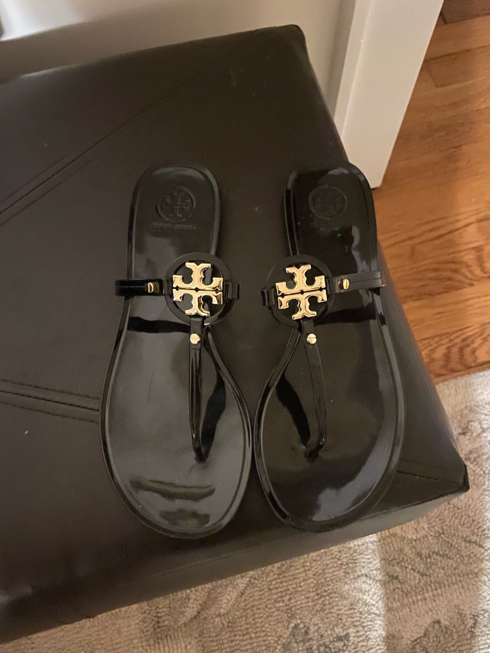 Tory Burch Black Jelly Thong Sandals with Gold Logo Medallion